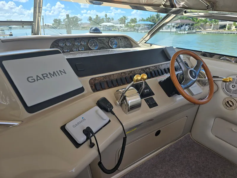 Slide: The Image of Interior view of 1998 Sea Ray 450 Sundancer cockpit with Garmin navigation. - 24