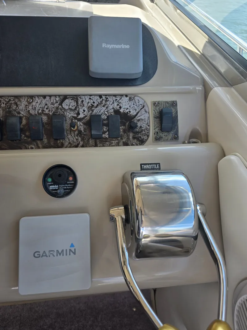 Slide: The Image of 1998 Sea Ray 450 Sundancer helm with Garmin and Raymarine equipment. - 28