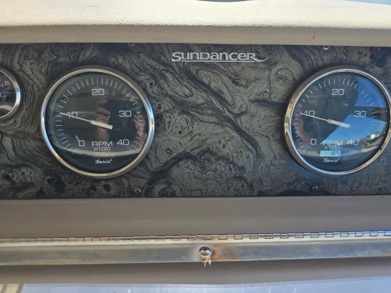 Slide: The Image of Dashboard of 1998 Sea Ray 450 Sundancer with gauges. - 30
