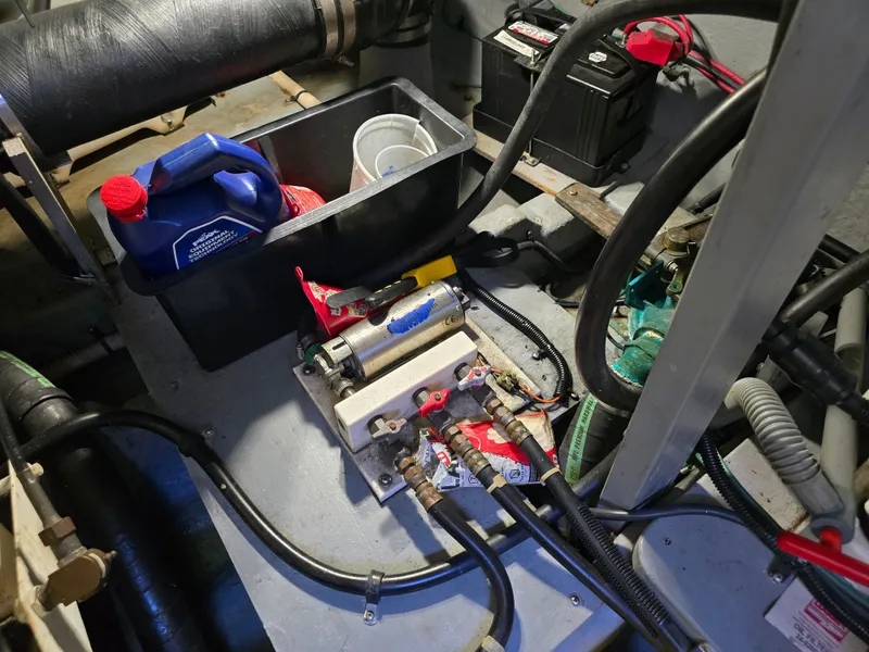 Slide: The Image of Engine room of a 1998 Sea Ray 450 Sundancer with battery and cables. - 35