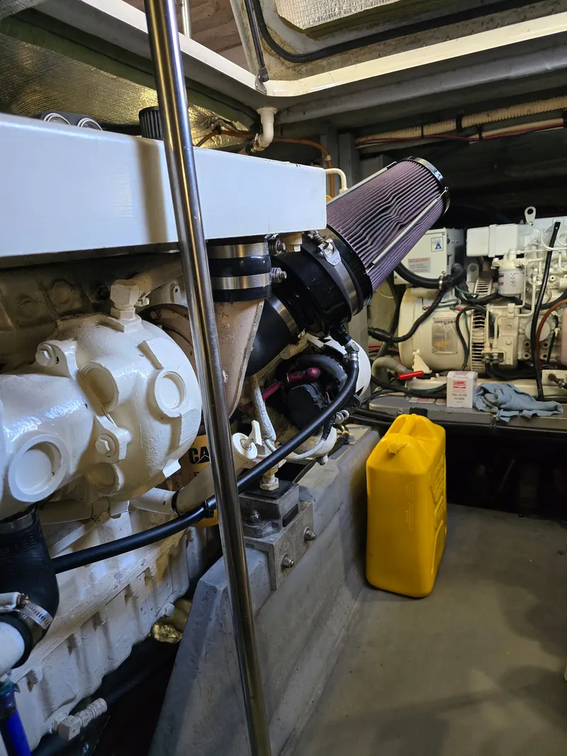 Slide: The Image of Engine room of 1998 Sea Ray 450 Sundancer with yellow canister. - 38