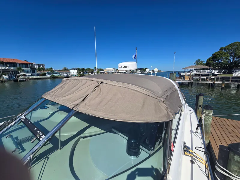 Slide: The Image of 1998 Sea Ray 450 Sundancer docked with canopy. - 4