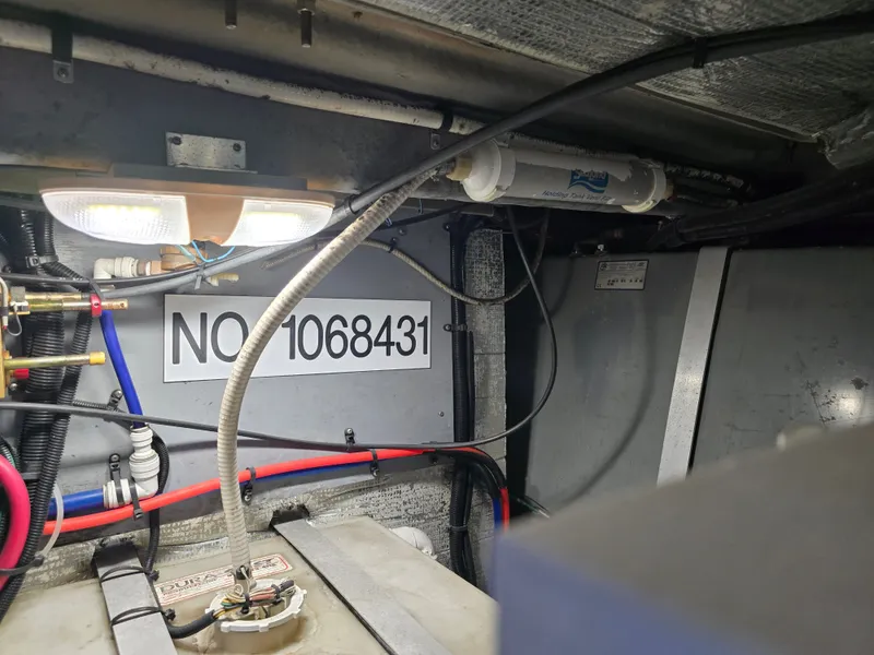 Slide: The Image of Interior of a 1998 Sea Ray 450 Sundancer with wiring. - 40