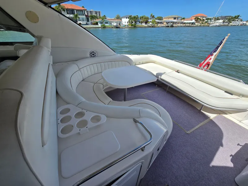 Slide: The Image of Interior of a 1998 Sea Ray 450 Sundancer yacht with seating area. - 7