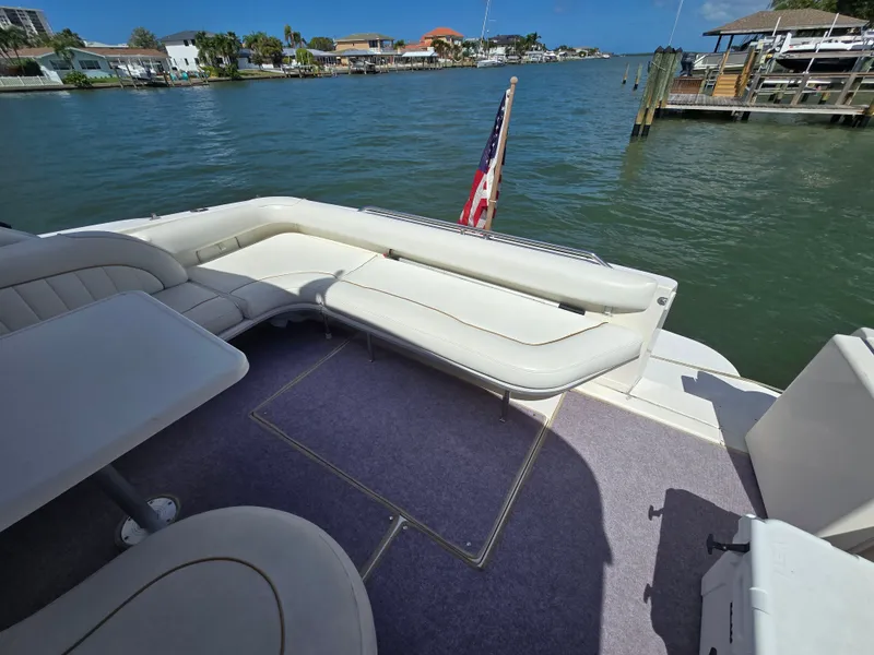 Slide: The Image of Deck area of 1998 Sea Ray 450 Sundancer with seating. - 8