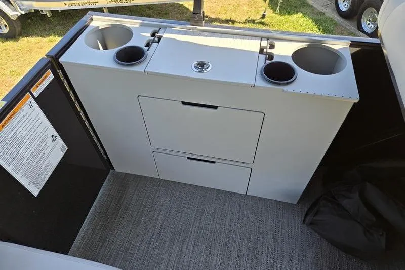 Slide: The Image of 2024 Godfrey Mighty G 1476 C boat interior with storage and cup holders. - 14