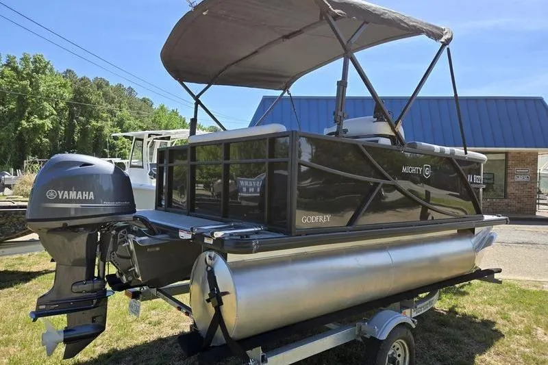 Slide: The Image of 2024 Godfrey Mighty G 1476 C pontoon boat with Yamaha motor on trailer. - 4