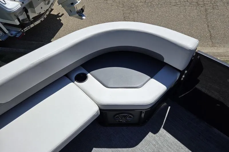 Slide: The Image of 2024 Godfrey Mighty G 1476 C boat seating area with cup holder and speaker. - 5