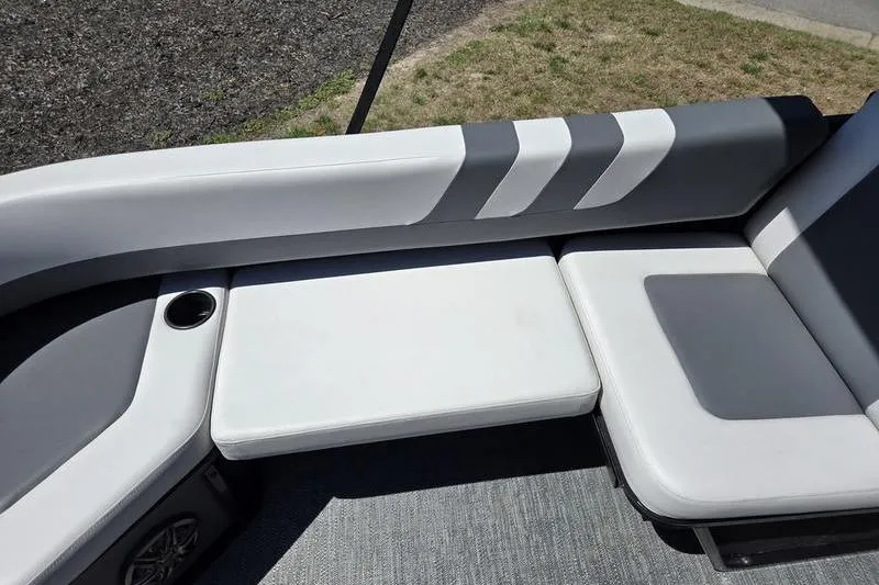 Slide: The Image of 2024 Godfrey Mighty G 1476 C boat seating with cup holder and stylish upholstery. - 6