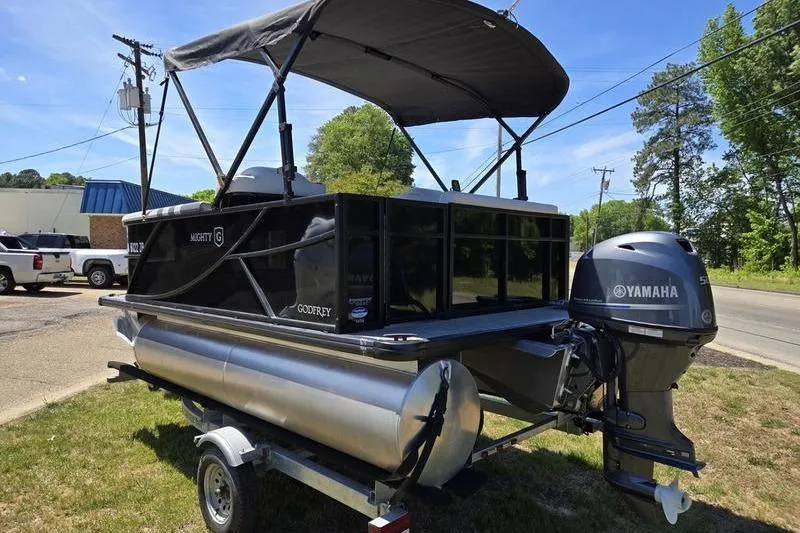 Slide: The Image of 2024 Godfrey Mighty G 1476 C pontoon boat with Yamaha motor on trailer. - 8