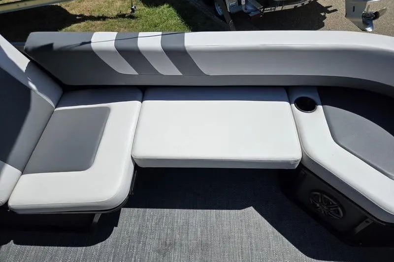 Slide: The Image of Luxurious seating on 2024 Godfrey Mighty G 1476 C boat, featuring sleek gray upholstery. - 9