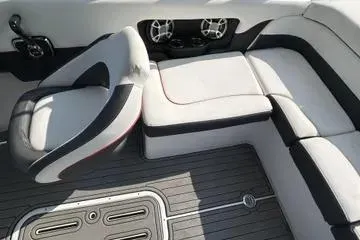 Slide: The Image of 2019 Bryant 210 boat interior with cushioned seating and modern design. - 6