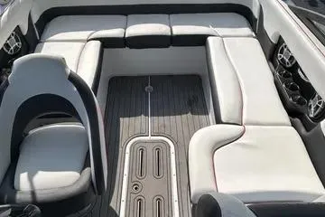 Slide: The Image of 2019 Bryant 210 boat interior with white seating and sleek design. - 8