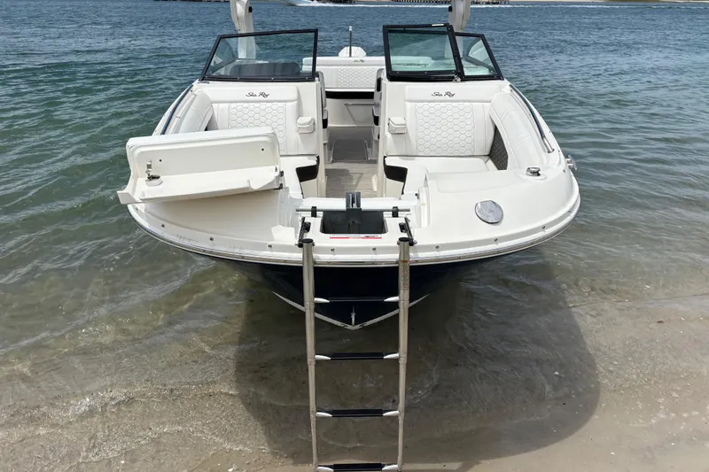 Slide: The Image of 2019 Sea Ray SDX 270 Outboard boat on sandy shore with open bow seating. - 12