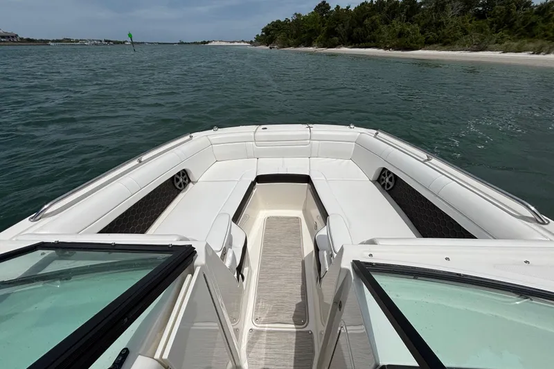 Slide: The Image of 2019 Sea Ray SDX 270 Outboard boat with spacious seating on calm waters. - 14