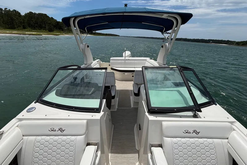 Slide: The Image of 2019 Sea Ray SDX 270 Outboard boat cruising on a scenic waterway. - 15