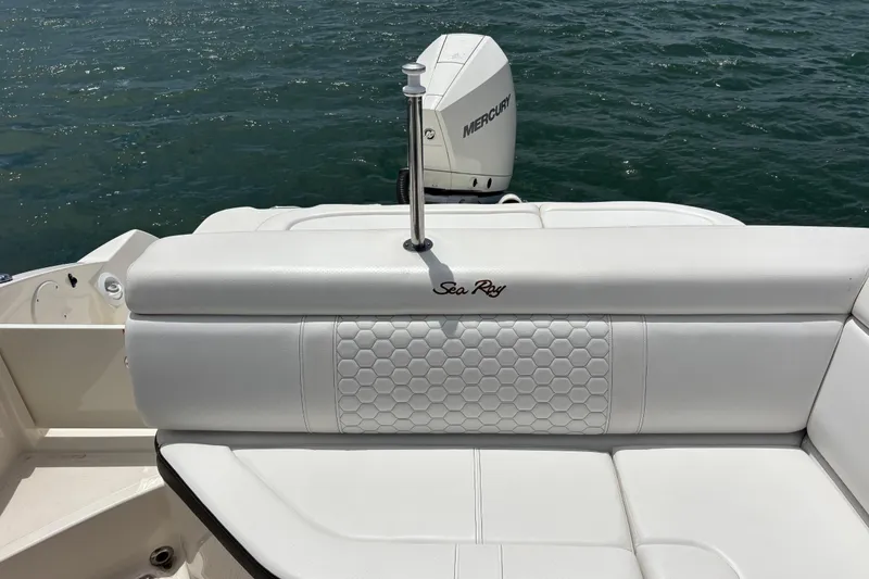 Slide: The Image of 2019 Sea Ray SDX 270 Outboard boat with white seating and Mercury engine on water. - 21