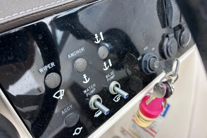 Slide: The Image of Control panel of a 2019 Sea Ray SDX 270 Outboard with keys inserted. - 29