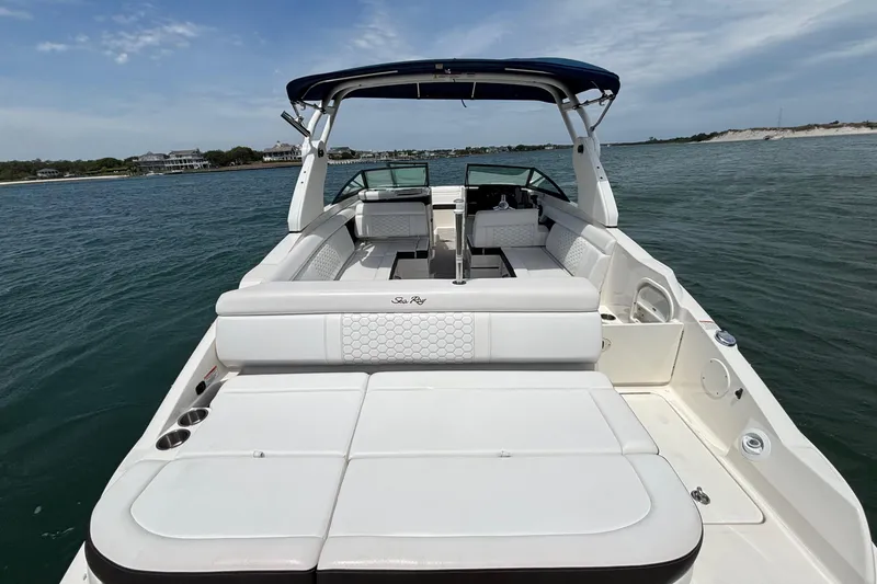 Slide: The Image of 2019 Sea Ray SDX 270 Outboard boat with spacious seating on open water. - 43