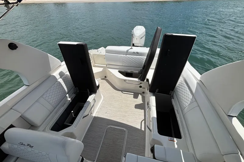 Slide: The Image of 2019 Sea Ray SDX 270 Outboard boat interior with open storage compartments. - 47