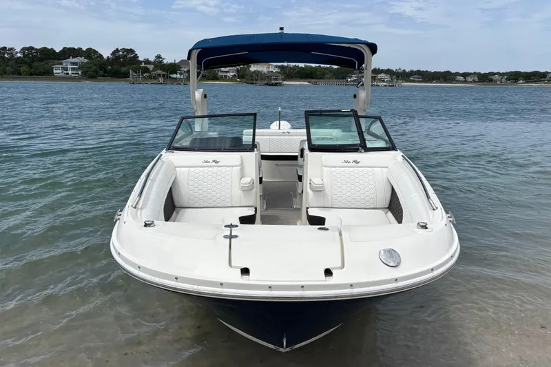 Slide: The Image of 2019 Sea Ray SDX 270 Outboard boat on calm water, featuring spacious seating. - 5