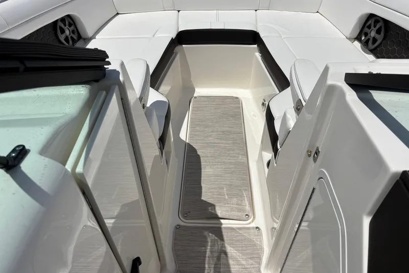 Slide: The Image of 2019 Sea Ray SDX 270 Outboard interior with white seating and modern design. - 51