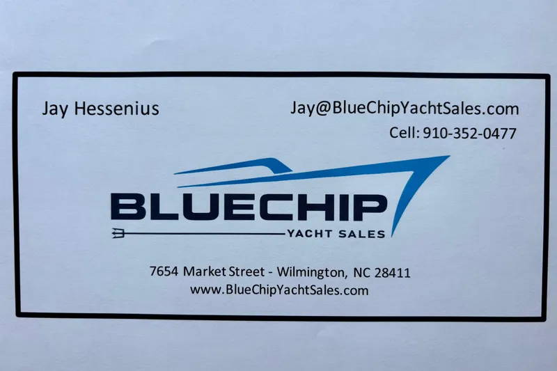 Slide: The Image of Business card for Blue Chip Yacht Sales, featuring contact details and logo. - 56