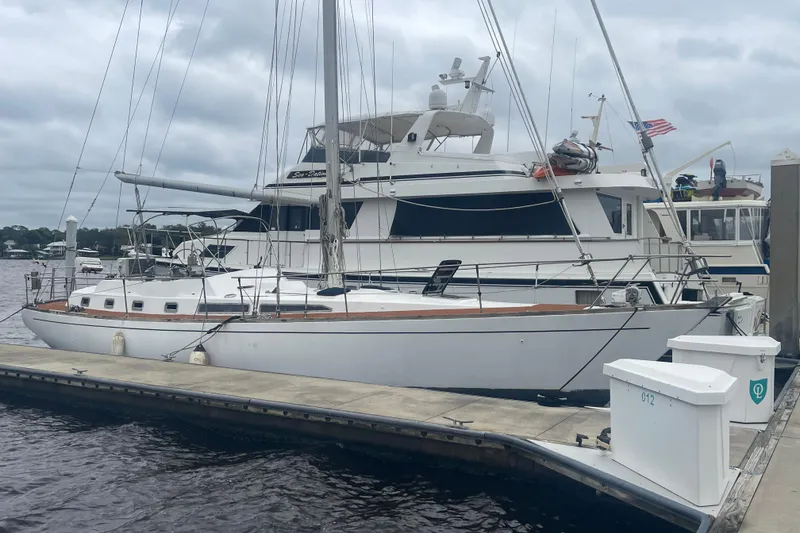 Slide: The Image of Sailboat docked at marina, TA Chaio CT47, 1984 model, overcast sky. - 17