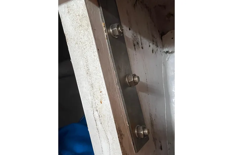 Slide: The Image of Close-up of metal bolts on a TA chaio CT47, 1984 model. - 20