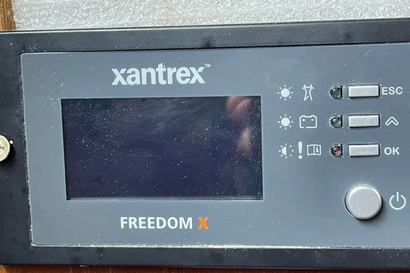 Slide: The Image of Control panel of a Xantrex Freedom X inverter, featuring buttons and display. - 21