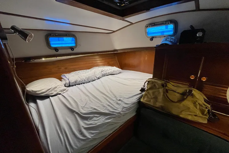 Slide: The Image of Cozy cabin interior of 1984 TA Chaio CT47 yacht with bed and portholes. - 4