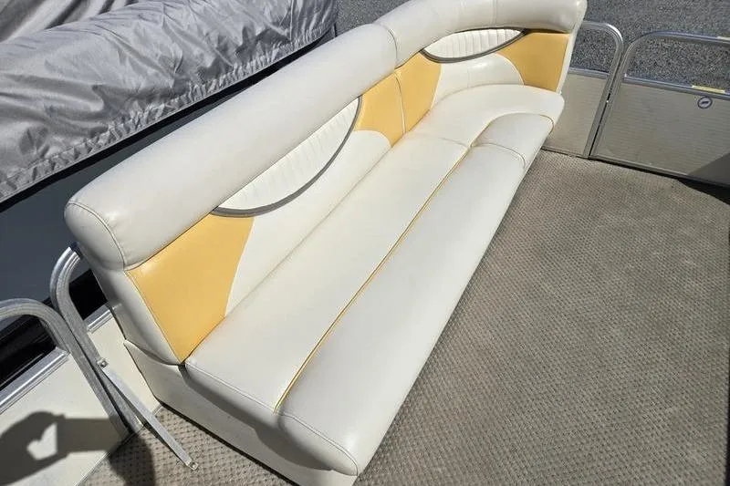 Slide: The Image of Cream and yellow seating on a 2008 Sweetwater 2386RE pontoon boat. - 13
