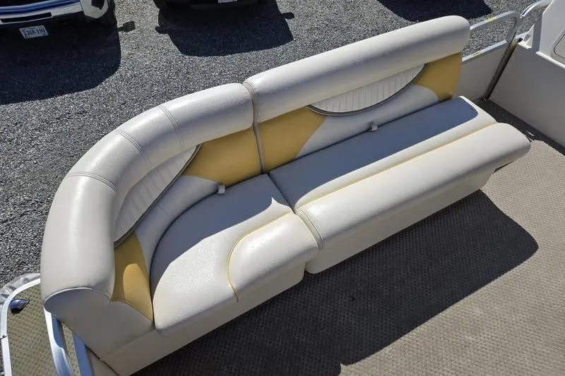 Slide: The Image of 2008 Sweetwater 2386RE boat seating with beige and yellow upholstery on deck. - 14