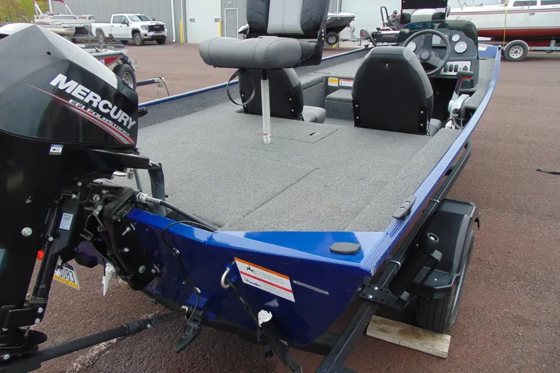 Slide: The Image of 2020 Crestliner 1700 Storm boat with Mercury engine, featuring spacious deck and seating. - 11