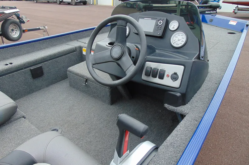 Slide: The Image of 2020 Crestliner 1700 Storm boat interior with steering wheel and control panel. - 12