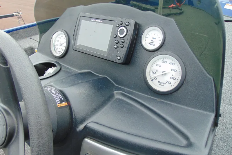 Slide: The Image of Dashboard of 2020 Crestliner 1700 Storm boat with gauges and Humminbird device. - 13