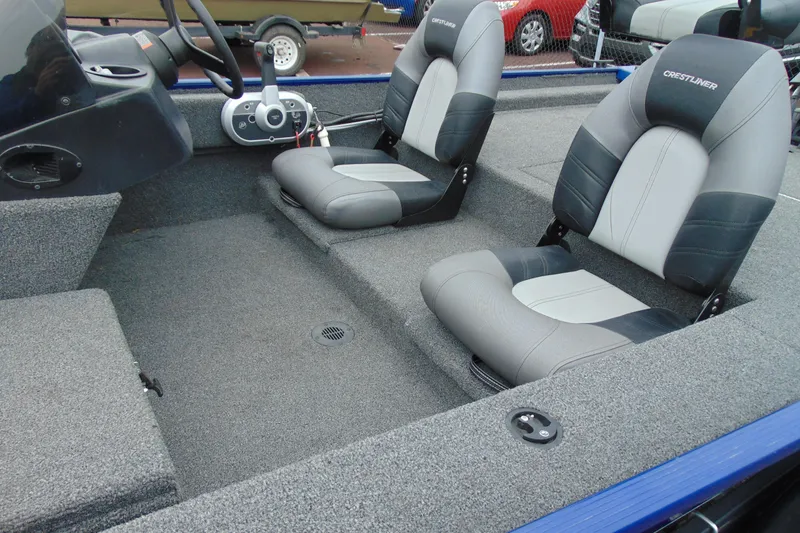 Slide: The Image of 2020 Crestliner 1700 Storm boat interior with gray seating and steering console. - 5