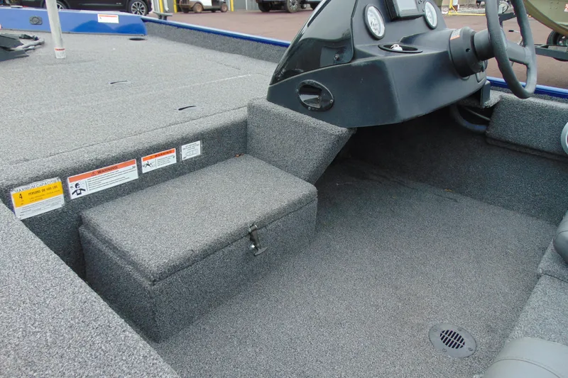 Slide: The Image of 2020 Crestliner 1700 Storm boat interior with steering console and storage compartment. - 6