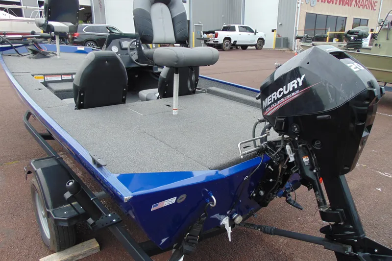 Slide: The Image of 2020 Crestliner 1700 Storm boat with Mercury outboard motor, parked on a trailer. - 8