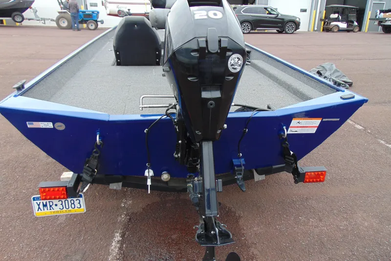 Slide: The Image of 2020 Crestliner 1700 Storm boat with outboard motor, parked on a trailer. - 9