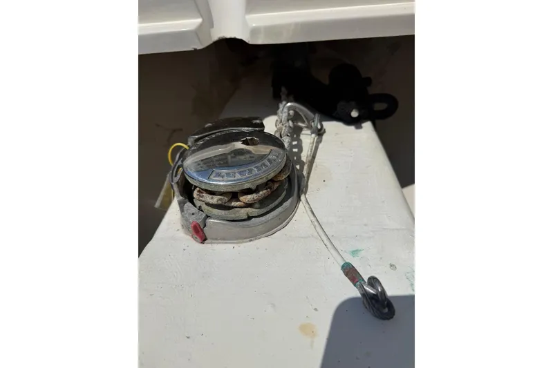 Slide: The Image of 2015 Cobia 296 Center Console boat anchor winch mechanism. - 15