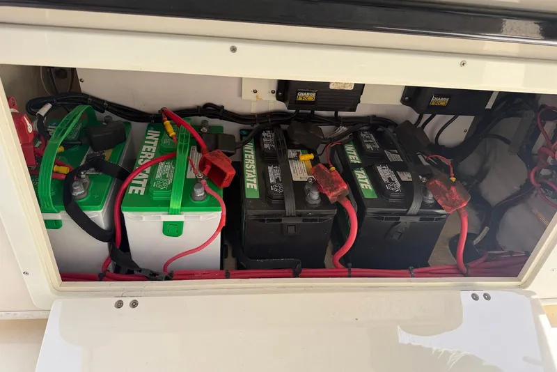Slide: The Image of Battery compartment of a 2015 Cobia 296 Center Console with Interstate batteries. - 17