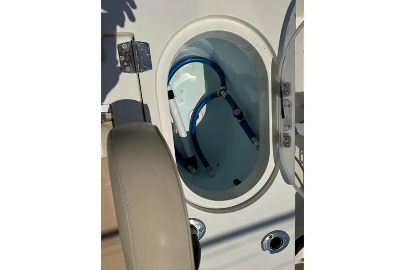 Slide: The Image of Livewell compartment on a 2015 Cobia 296 Center Console boat. - 5