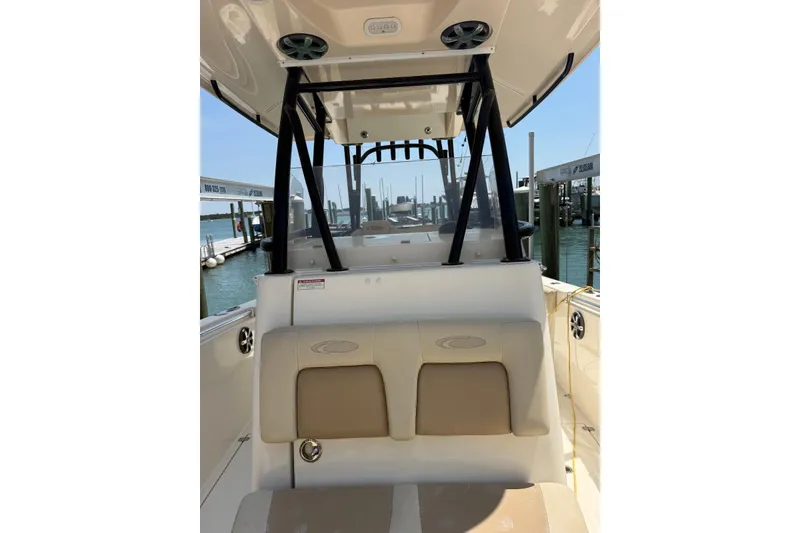 Slide: The Image of 2015 Cobia 296 Center Console boat interior at marina dock. - 8