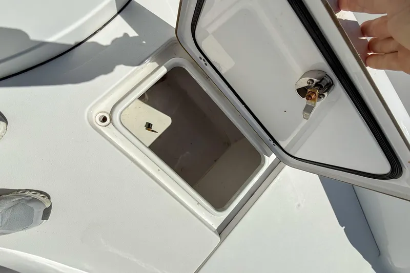 Slide: The Image of Open storage compartment on 2019 Sportsman Open 282 Center Console boat. - 10