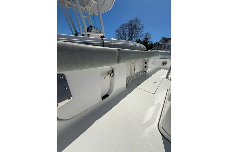 Slide: The Image of 2019 Sportsman Open 282 Center Console boat interior with seating and storage compartments. - 11