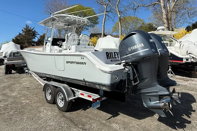 Slide: The Image of 2019 Sportsman Open 282 Center Console boat with twin Yamaha engines on trailer. - 2