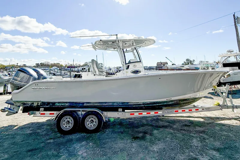 Slide: The Image of 2019 Sportsman Open 282 Center Console boat on trailer at marina. - 3