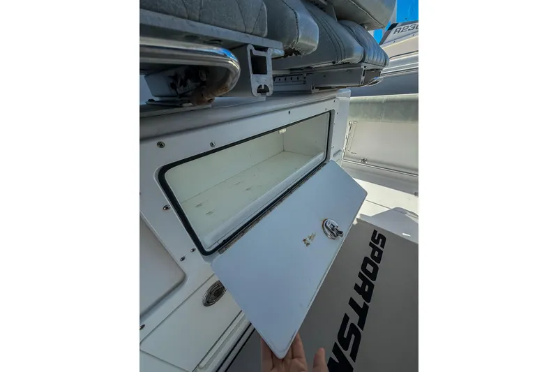 Slide: The Image of Open storage compartment on a 2019 Sportsman Open 282 Center Console boat. - 7