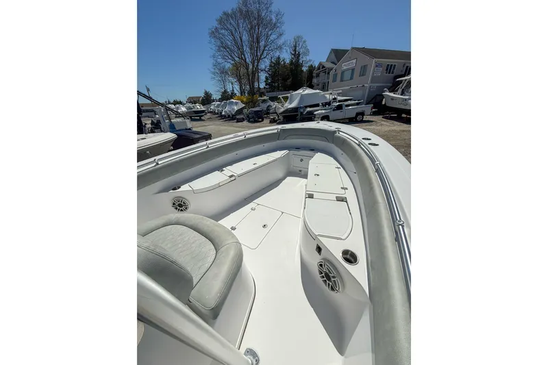Slide: The Image of 2019 Sportsman Open 282 Center Console boat interior with seating and storage compartments. - 8